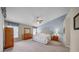 Spacious main bedroom with vaulted ceilings, ceiling fan, and large windows at 17124 Falconridge Rd, Lithia, FL 33547
