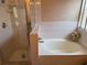 Bathroom showcasing a separate glass-enclosed shower and a luxurious soaking tub at 1765 Oak Pond Ct, Oldsmar, FL 34677