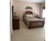 Cozy bedroom showcasing a bed with stylish bedding and complementary furniture set at 1765 Oak Pond Ct, Oldsmar, FL 34677