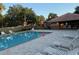 Inviting community pool with lounge chairs and a nearby playground, perfect for Gathering fun at 1765 Oak Pond Ct, Oldsmar, FL 34677