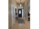 Welcoming foyer with tile flooring, decorative rug, high ceilings, and stylish console table at 1765 Oak Pond Ct, Oldsmar, FL 34677