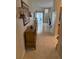 Long hallway with tile flooring, decorative sconces, leading to a bright living space at 1765 Oak Pond Ct, Oldsmar, FL 34677