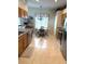 Bright kitchen with stainless steel appliances, tile flooring, and adjacent breakfast nook at 1765 Oak Pond Ct, Oldsmar, FL 34677