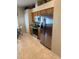 Well-lit kitchen featuring stainless steel appliances, tile floors, and light wood cabinetry at 1765 Oak Pond Ct, Oldsmar, FL 34677