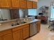 Spacious kitchen featuring stainless steel appliances, lots of cabinets, and breakfast nook at 1765 Oak Pond Ct, Oldsmar, FL 34677
