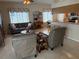 Inviting living room with plush seating, decorative accents, and an open layout connecting to the kitchen at 1765 Oak Pond Ct, Oldsmar, FL 34677