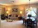Comfortable living and dining area with coordinated furnishings and lots of natural light at 1765 Oak Pond Ct, Oldsmar, FL 34677