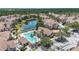 Stunning aerial view of a community with a pool, beautiful landscaping, lake, and well-maintained buildings at 18017 Villa Creek Dr # 18017, Tampa, FL 33647