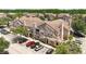 Exterior view of a condominium with multiple units and a parking lot with several cars at 18017 Villa Creek Dr # 18017, Tampa, FL 33647