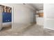 Unfinished room featuring damage and doorway into kitchen with white refrigerator and wood cabinets at 18017 Villa Creek Dr # 18017, Tampa, FL 33647