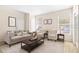 Bright living room with neutral decor, comfortable seating, and large window at 18017 Villa Creek Dr # 18017, Tampa, FL 33647