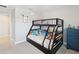 bedroom with bunk beds, lots of stuffed animals and blue storage unit at 18219 Ramble On Way, Land O Lakes, FL 34638