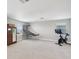 Spacious bonus room with neutral carpet, natural light, and ample space for recreation at 18219 Ramble On Way, Land O Lakes, FL 34638