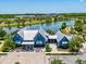 An aerial shot of the community clubhouse with a scenic lake backdrop at 18219 Ramble On Way, Land O Lakes, FL 34638