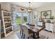 A charming dining room with large windows and a view of the landscape at 18219 Ramble On Way, Land O Lakes, FL 34638