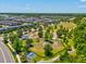 Aerial view of a dog park and green spaces near residential areas, creating a vibrant and pet-friendly community at 18219 Ramble On Way, Land O Lakes, FL 34638
