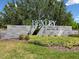 Bexley by Newland community entrance sign with lush landscaping at 18219 Ramble On Way, Land O Lakes, FL 34638