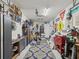 Organized garage featuring painted walls, speckled flooring, tool storage, work surfaces and unique wall decor at 18219 Ramble On Way, Land O Lakes, FL 34638