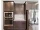 A modern kitchen with stainless steel appliances and beautiful cabinetry at 18219 Ramble On Way, Land O Lakes, FL 34638