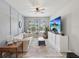 Cozy living room with modern decor, ceiling fan, and large flat screen television at 18219 Ramble On Way, Land O Lakes, FL 34638