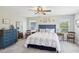 Bright main bedroom with neutral decor, natural light, and ample space for relaxation at 18219 Ramble On Way, Land O Lakes, FL 34638