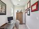 A well-appointed office space with natural light and an antique wooden cabinet at 18219 Ramble On Way, Land O Lakes, FL 34638