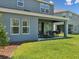 Covered patio with sliding glass doors, and an outdoor grill at 18219 Ramble On Way, Land O Lakes, FL 34638