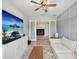 Comfortable sitting room offering neutral paint, ceiling fan, and television at 18219 Ramble On Way, Land O Lakes, FL 34638