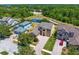 Aerial view of the homes, manicured lawns and community pond at 19407 Sweet Grass Way, Lutz, FL 33558