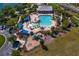 Overhead view of a community pool, playground, and clubhouse, providing residents with many recreational options at 19407 Sweet Grass Way, Lutz, FL 33558