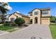 Charming two-story home featuring a three-car garage and a meticulously designed brick driveway at 19407 Sweet Grass Way, Lutz, FL 33558