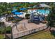 Aerial view of a community playground with slides, swings, and climbing structures, offering fun for all ages at 19407 Sweet Grass Way, Lutz, FL 33558