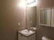 Simple bathroom with a single sink vanity, mirror, and standard fixtures at 2002 E 5Th Ave # 110, Tampa, FL 33605