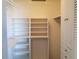 White shelving and storage units in a spacious walk-in closet at 2002 E 5Th Ave # 110, Tampa, FL 33605