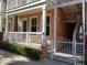 Charming multi-level townhome featuring a white fence and a private porch for relaxing outdoors at 2002 E 5Th Ave # 110, Tampa, FL 33605