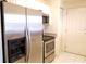 Modern kitchen featuring stainless steel appliances, white cabinetry, and a sleek design at 2002 E 5Th Ave # 110, Tampa, FL 33605
