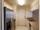 Well-equipped kitchen featuring stainless steel appliances, white tile flooring, and ample counter space at 2002 E 5Th Ave # 110, Tampa, FL 33605