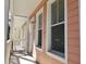 Charming multi-level townhome featuring a private porch with a calming ambiance and a relaxing outdoor space at 2002 E 5Th Ave # 110, Tampa, FL 33605