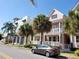 Street view of a residential street showcasing colorful homes and palm trees at 2002 E 5Th Ave # 110, Tampa, FL 33605