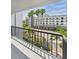 A view of the building with tall palm trees, seen from the balcony of the property at 201 W Laurel St # 504B, Tampa, FL 33602