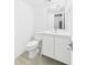 This bathroom has all-white fixtures with a modern faucet and a bright mirror at 201 W Laurel St # 504B, Tampa, FL 33602