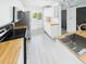 Bright kitchen featuring stainless steel appliances, butcher block counters, and a view to the bathroom at 201 W Laurel St # 504B, Tampa, FL 33602