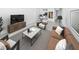 Beautifully staged living room with a modern sofa, stylish furniture, and an eye-catching rug at 201 W Laurel St # 504B, Tampa, FL 33602