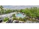 Overhead view of outdoor pool surrounded by mature trees and manicured landscaping with convenient parking at 201 W Laurel St # 504B, Tampa, FL 33602