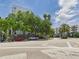 Street view showcasing modern apartment buildings, mature trees, and a well-maintained streetscape at 201 W Laurel St # 504B, Tampa, FL 33602