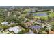 Aerial view of the property, showcasing the surrounding neighborhood and its proximity to a lush golf course at 206 Corbett St, Belleair, FL 33756