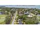 Aerial view of homes bordering a golf course, showing the neighborhood's layout and convenient access to recreation at 206 Corbett St, Belleair, FL 33756