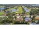 Stunning aerial view of a home adjacent to a beautiful golf course, highlighting its prime location and landscaping at 206 Corbett St, Belleair, FL 33756