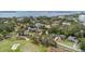 Breathtaking aerial view of homes near the bay, showcasing their proximity to the water and local golf course at 206 Corbett St, Belleair, FL 33756