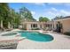 Beautiful backyard with pool, spa, and patio, perfect for outdoor entertaining at 206 Corbett St, Belleair, FL 33756